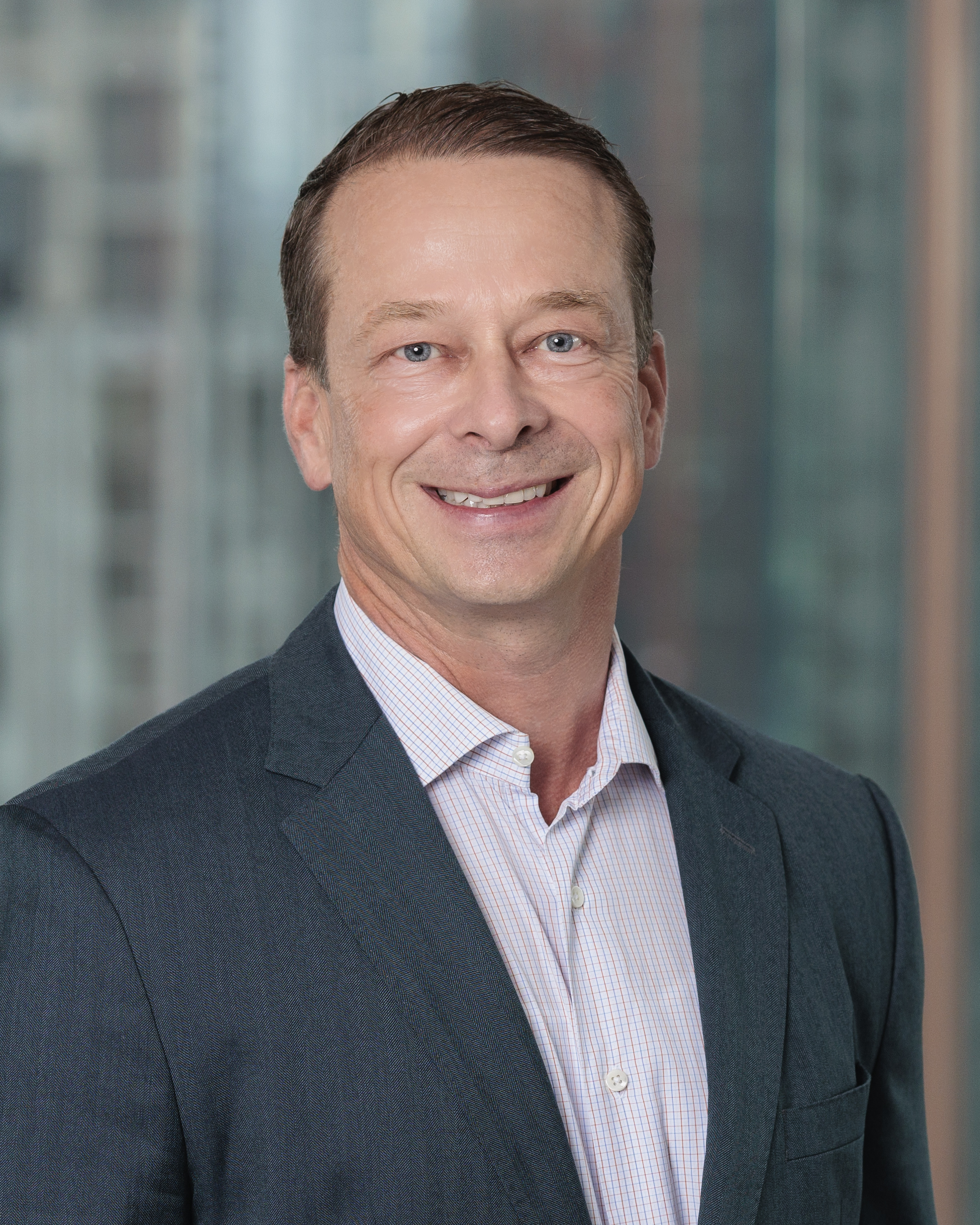 professional headshot of Adam Stoecker