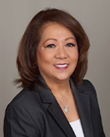 Professional headshot of Bennie Quevedo-Burris.