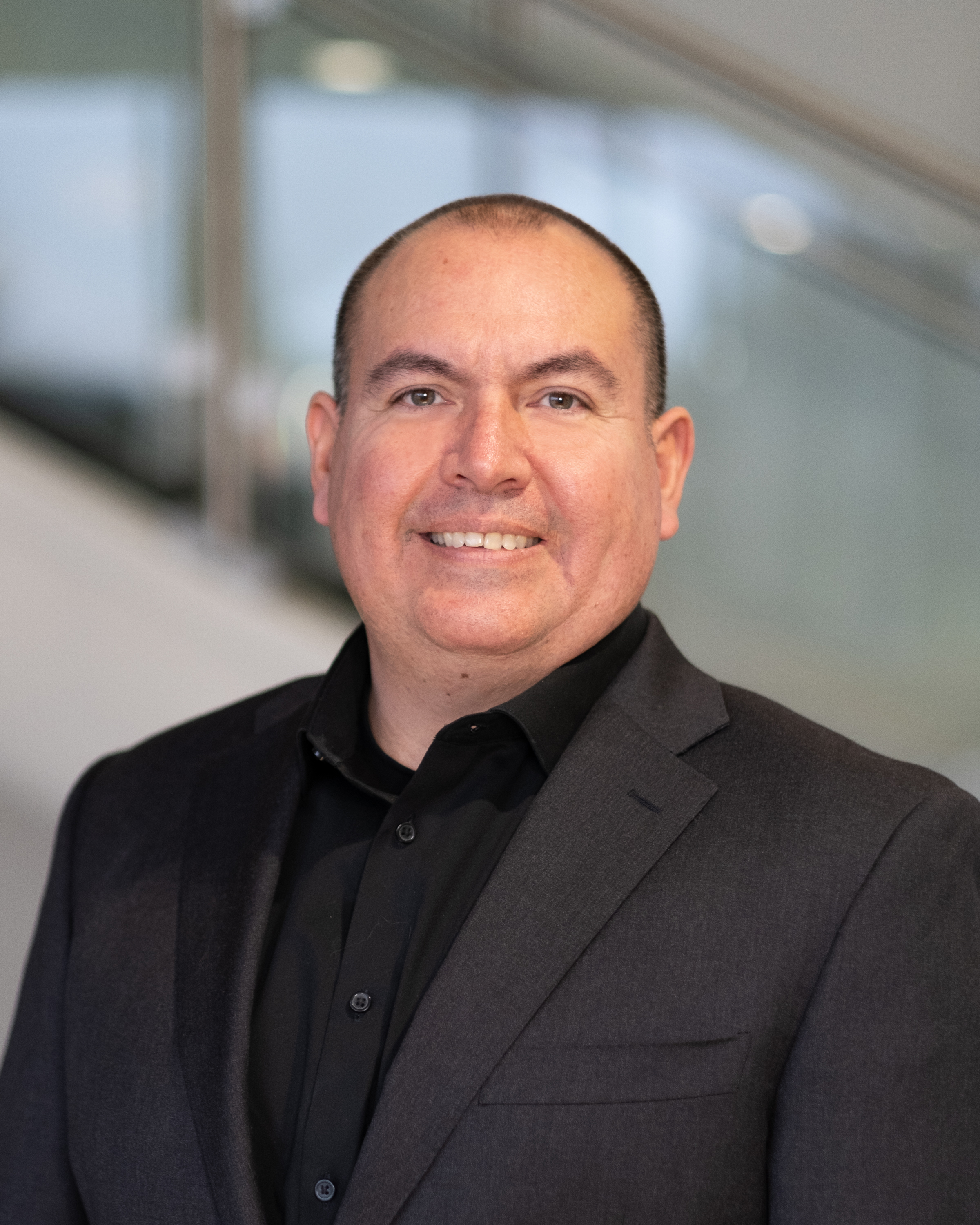Professional headshot of James Espana.